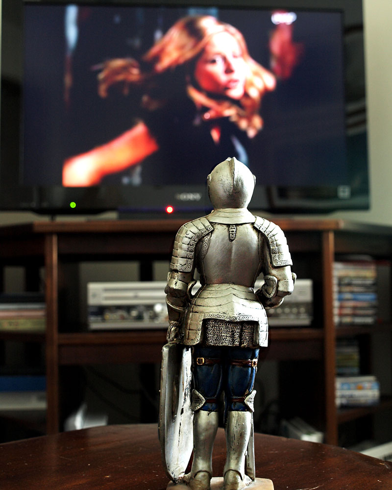 knight figurine in front of tv