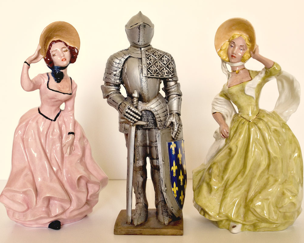 knight figurine with two porcelain ladies