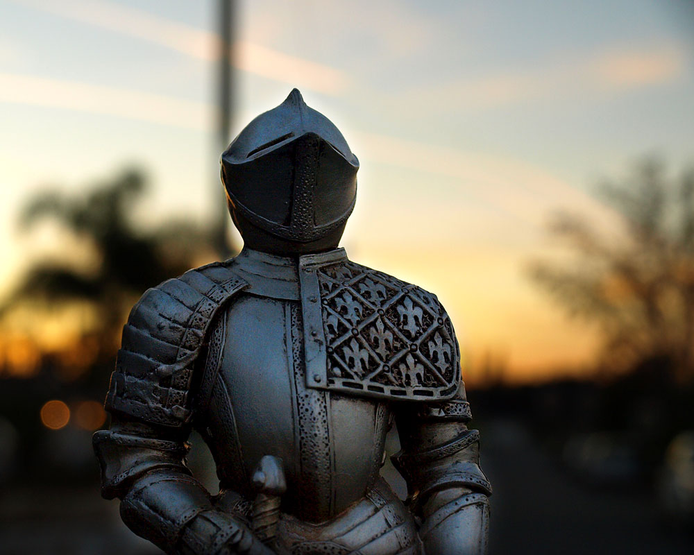 knight figurine with sunset