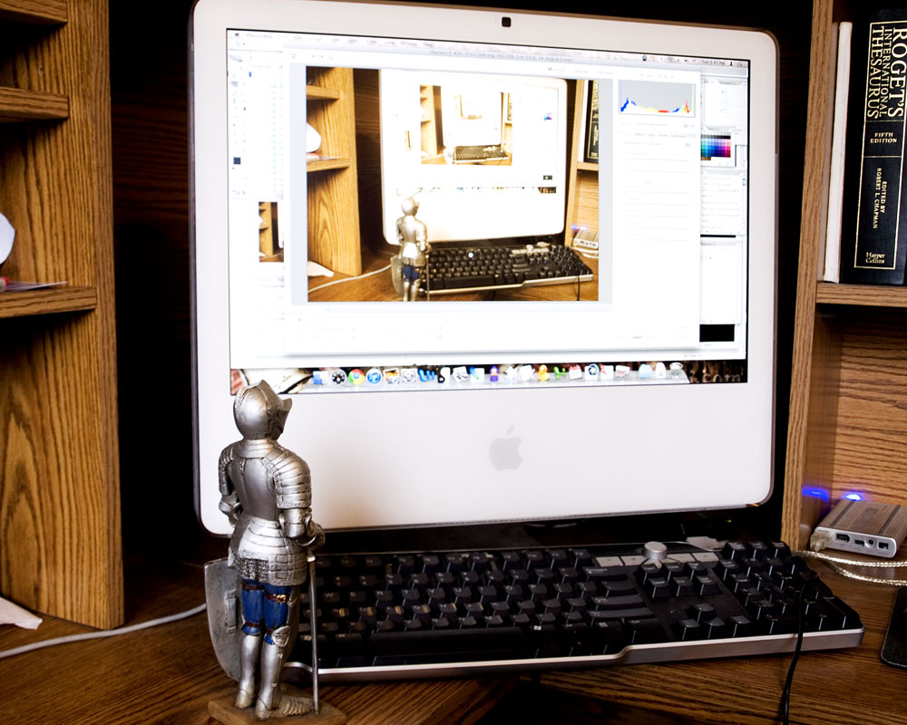 knight figurine in front of recursive computer screen