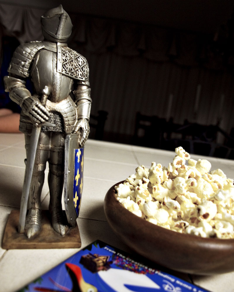 knight figure on counter next to bowl of popcorn