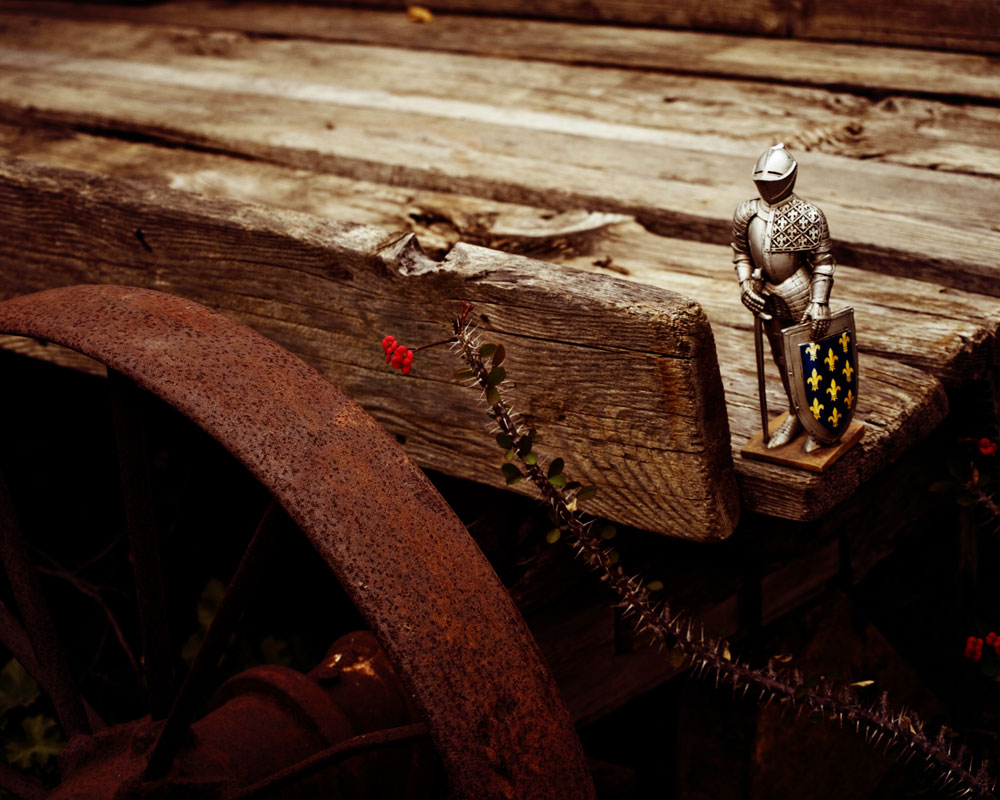knight figure on old wagon back