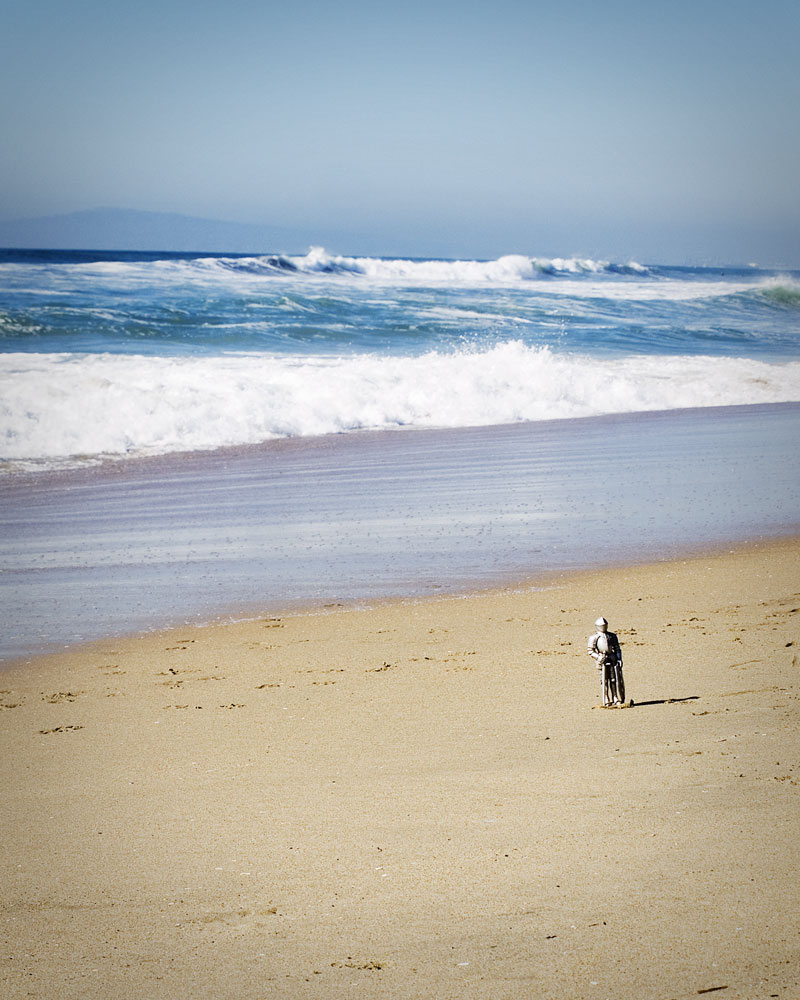 knight figure standing alone on beach
