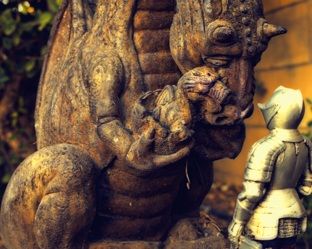 knight figure by dragon with baby figure