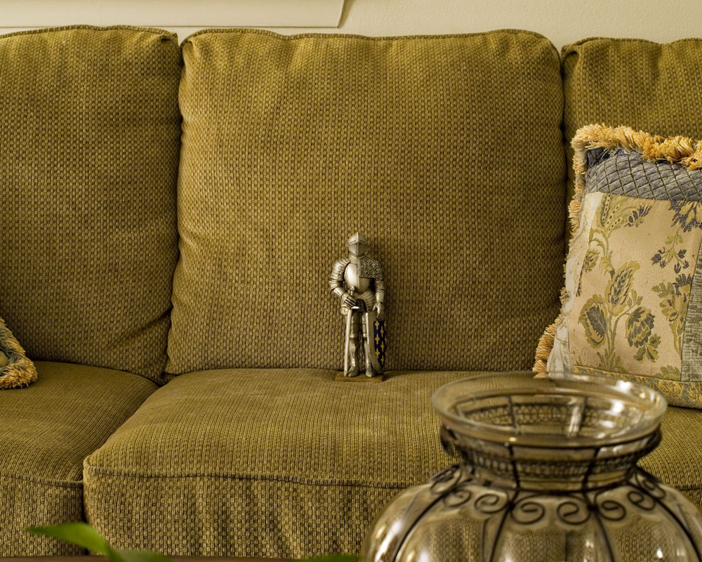knight figure sitting on sofa