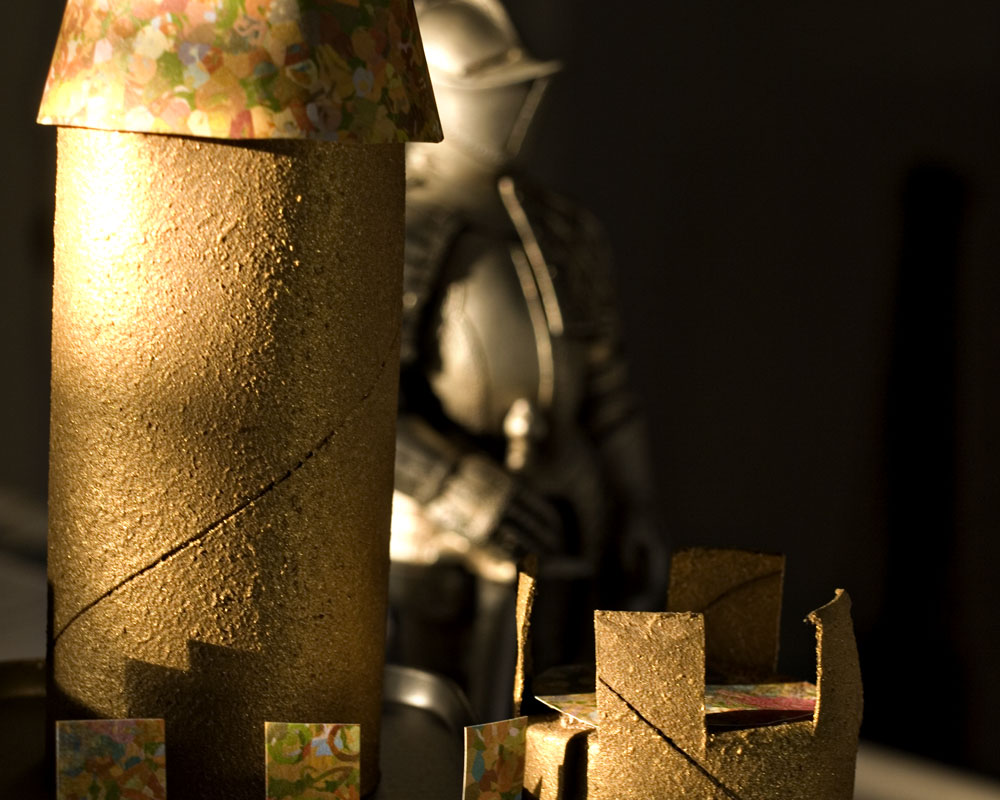 knight figure with toilet paper roll castle