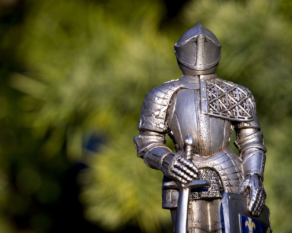 knight figure against green bokeh background