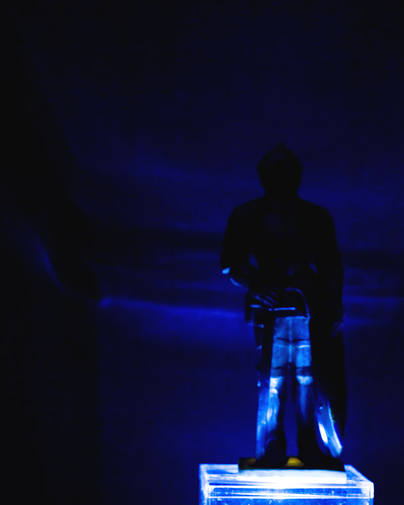 knight figure in dark with blue lighting
