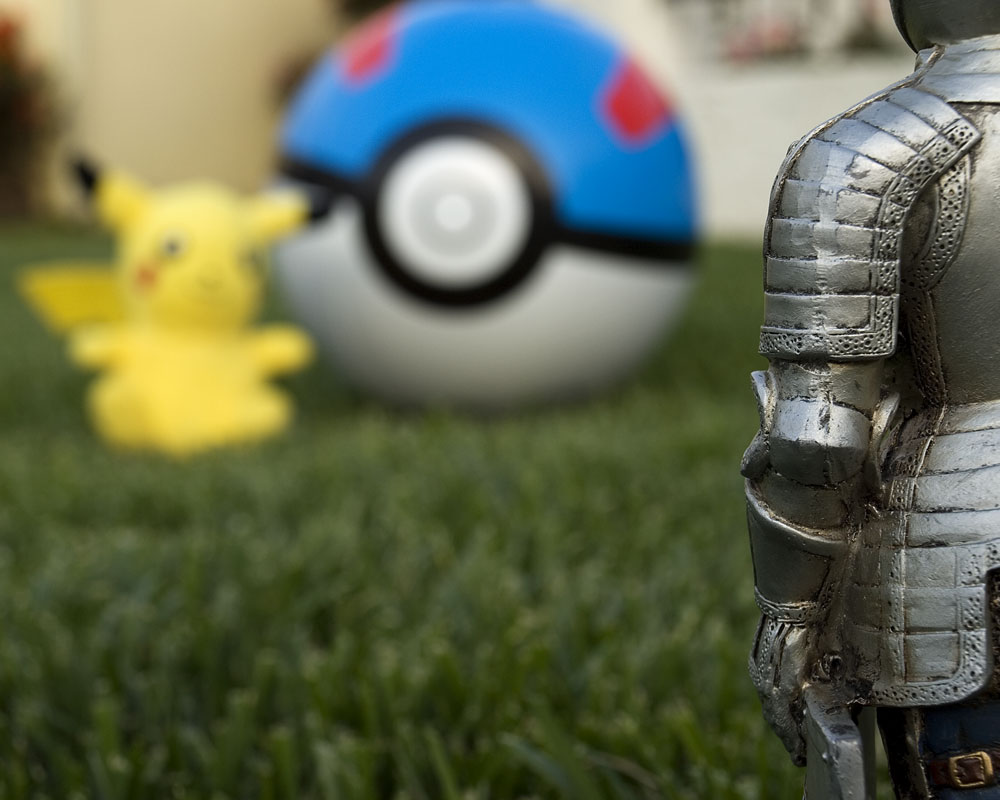 knight figure with pikachu and pokeball
