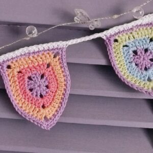 two crocheted flags in garland