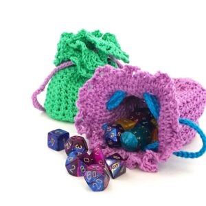 purple dice pouch with dice spilling out